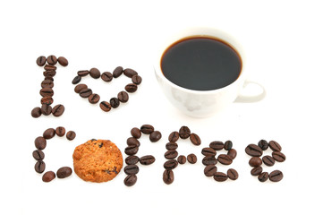 coffee cup and message written with coffee beans