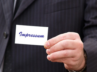 Hand Visitenkarte Impressum