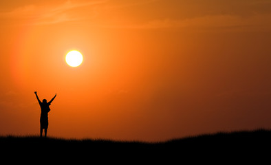 boy jumping silhouette sunset