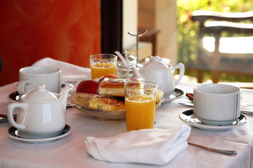 continental breakfast with orange juice, fruit and coffee