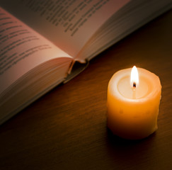Book in candlelight