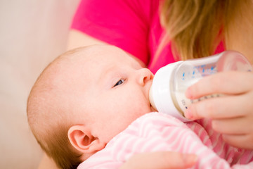 Artificial feeding of children.