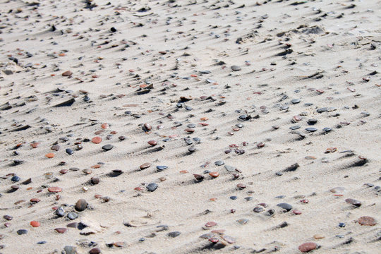 Texture of sand and stones on the beach