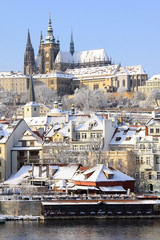 Fototapeta premium Romantic Snowy Prague gothic Castle above the River Vltava