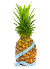 Pineapple with a measuring tape around