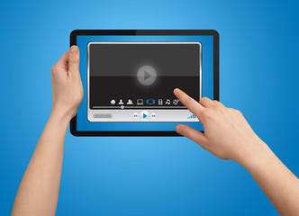 A male hand holding a touchpad media player