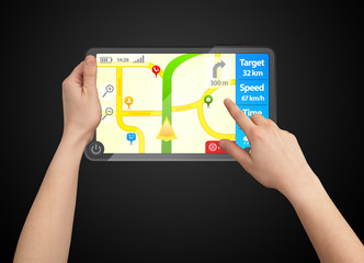 A male hand holding a touchpad gps isolated black