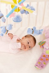 Baby girl with colorful toys
