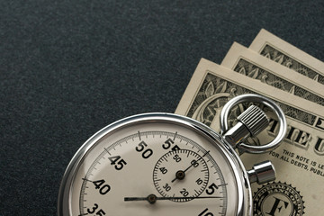 Stopwatch and dollar