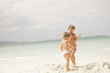 two children playing on beach