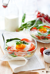 Baked egg with tomatoes and spinach