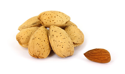 Group of almonds with one shelled