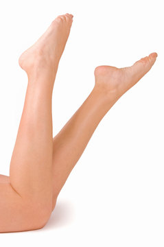Female feet isolated on white background