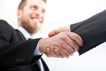 Two businessmen giving hands isolated on white