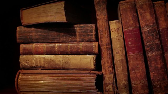 Ancient books in a bookshelf