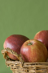 Apples before green background