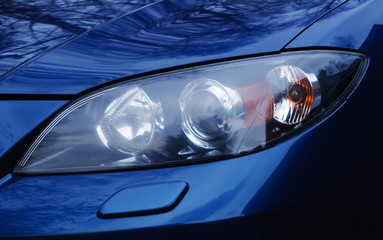 Automobile headlamp of a modern car. © Stanislav Voronov