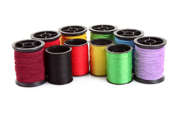 Few bobbins isolated on white