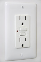 Outlet with secured button