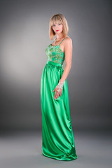 Fototapeta premium attractive young woman posing in evening outfit