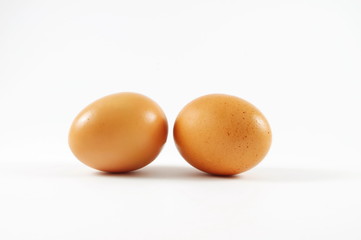 Two nice eggs liying on the isolated surface