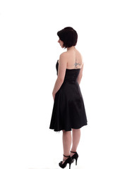 Back of a cute twenties girl in a black dress