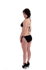 Back of a cute girl in a black bikini