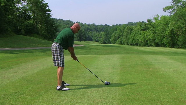 Golfer Teeing Off With Driver 03
