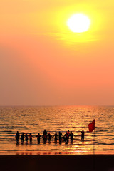 group of people enjoying the sunset