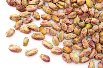 heap of roasted Pistachio isolated on white