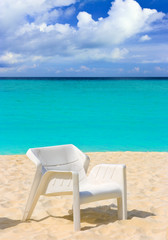 Fototapeta na wymiar Chair on tropical beach