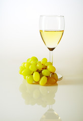 Glass of white wine and grapes