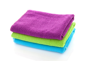 pile of colorful towels over white background