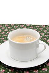 the cup of coffee on the table