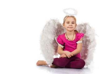 Beautiful girl in angel wings and nimbus