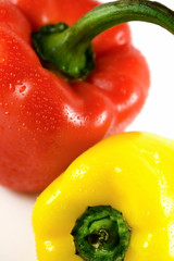 Red and yellow pepper with water drops