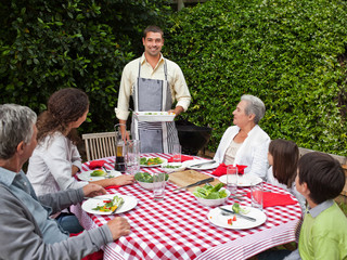 Portrait of a joyful family in the garden