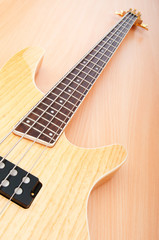 Fototapeta na wymiar Musical concept with wooden guitar
