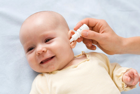 baby taking medicine