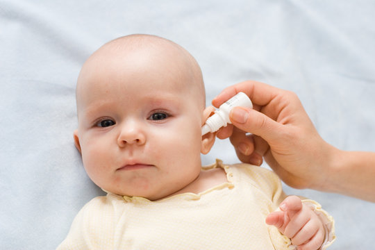 baby taking medicine