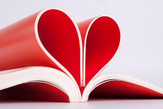Book pages folded into a heart shape