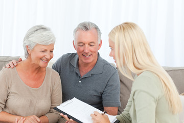 Seniors with doctor at home