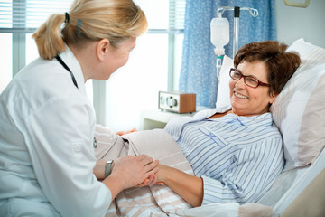 doctor or nurse talking to patient in hospital