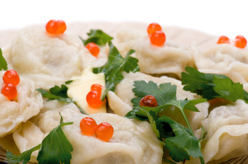 pelmeni with red caviar close up
