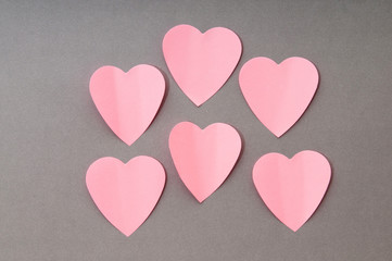 Heart shaped sticky notes on the background