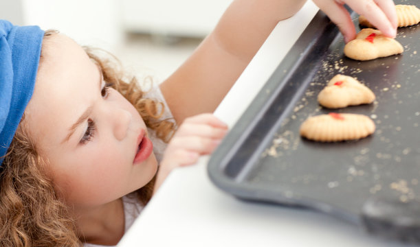 Little Girl Stealing Cookies