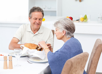 Retired couple eating  in the kitchen