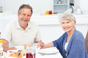 Retired couple eating  in the kitchen