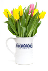 vase with yellow and pink tulips