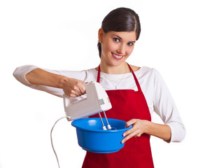 Frau mit Mixer und Schüssel